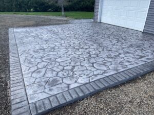 random stone brick border colored concrete driveway oregon