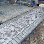 random stone brick border colored concrete driveway oregon