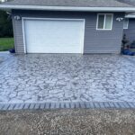 random stone brick border colored concrete driveway oregon